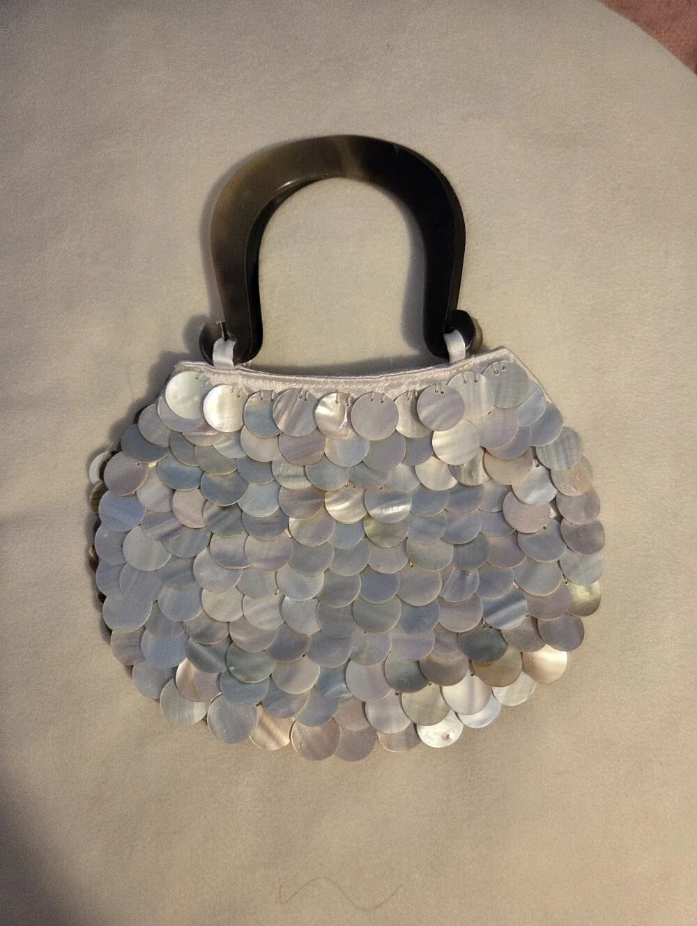Elegant Iridescent Abalone Shell Disc Handbag with Dark Handle